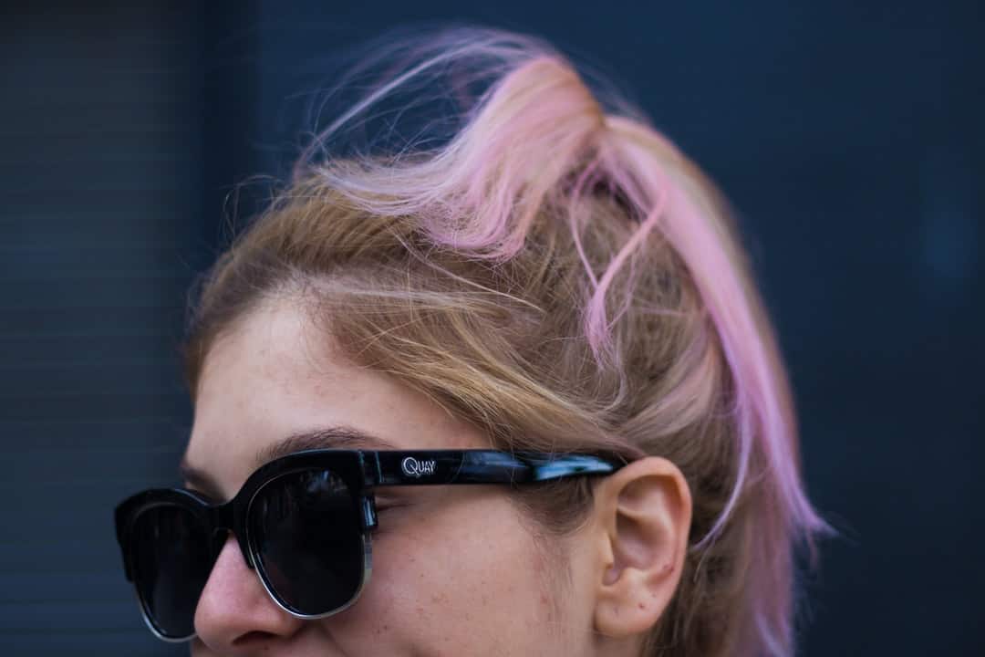 A close up of a person wearing sunglasses