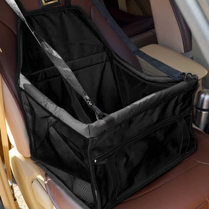 the image contains a seat carrier installed at a car seat